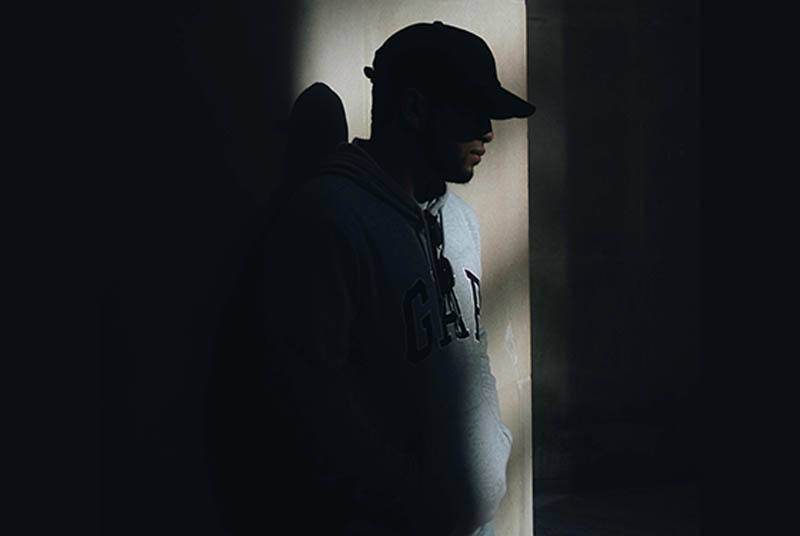 man wearing black hat