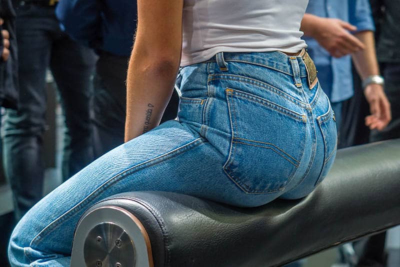 photo of woman in jeans sitting