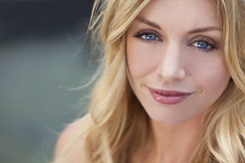 portrait of beautiful woman with blonde hair and blue eyes