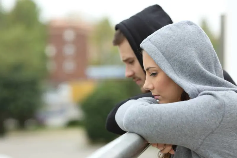 side view of unhappy couple in a balcony