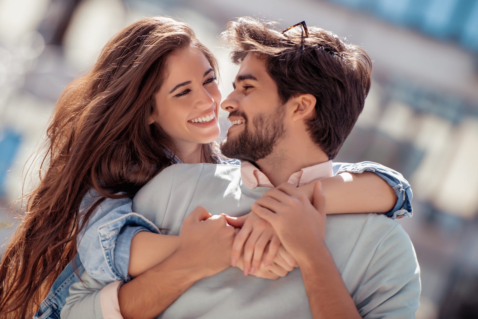 the man and woman embrace laughing