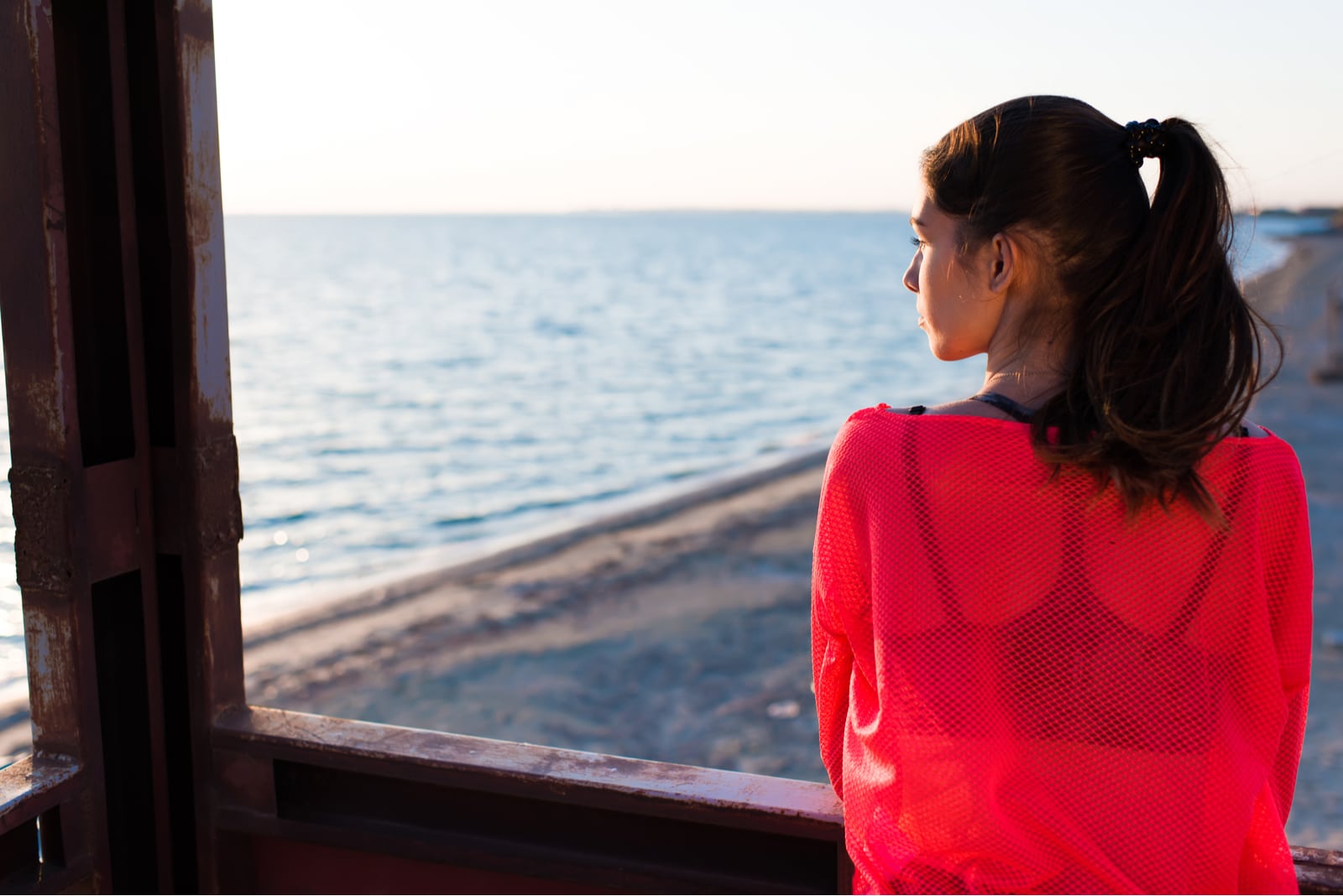 thoughtful charming woman enjoying beautiful landscape in summer day