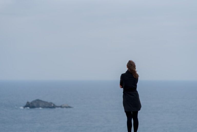 sad woman standing alone outdoor