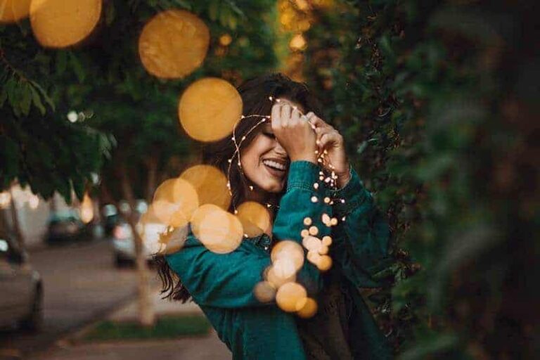 smiling woman on the sidewalk