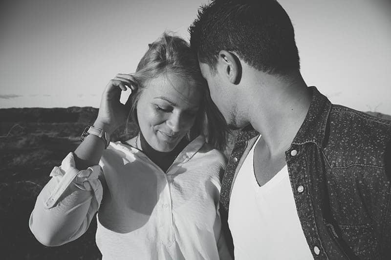 black and white of smiling woman and man