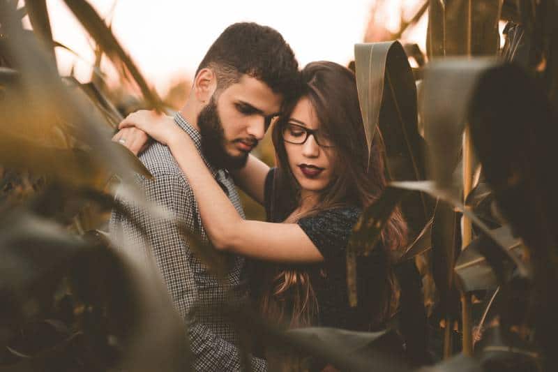 couple hugging in corn field