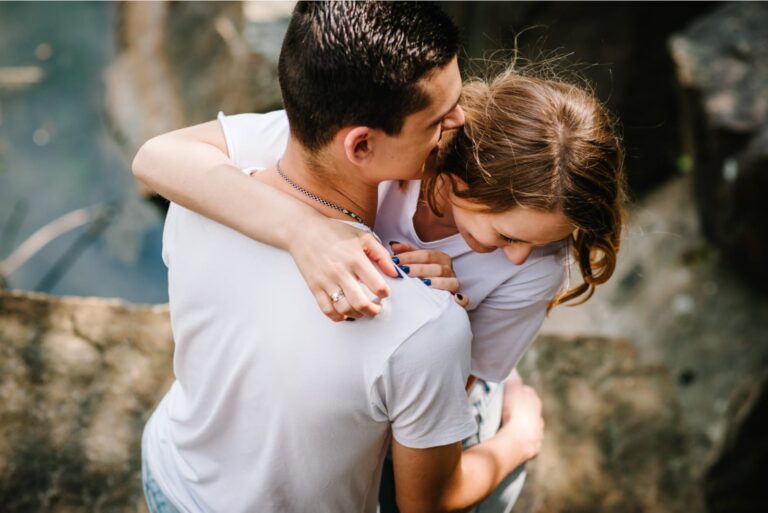 happy couple hugging and smiling