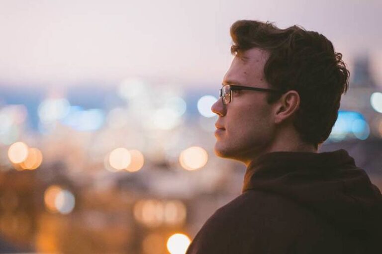 side view of man wearing eyeglasses shallow focus