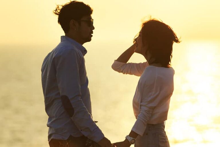 young couple relaxing on the sea side