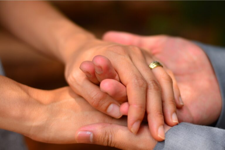 the hands of a married couple