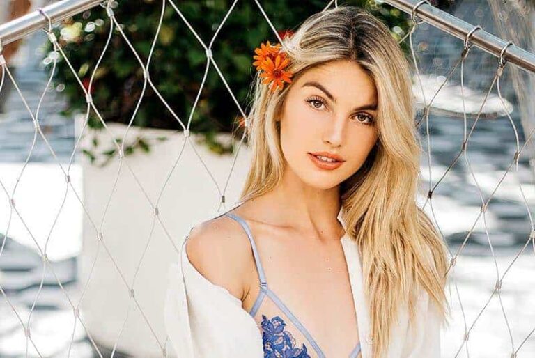 beautiful blonde woman having flower on her head