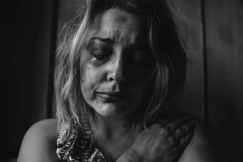 black and white photo of crying woman