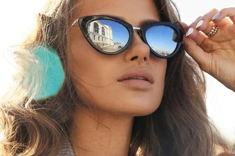 close up photo of woman wearing sunglasses