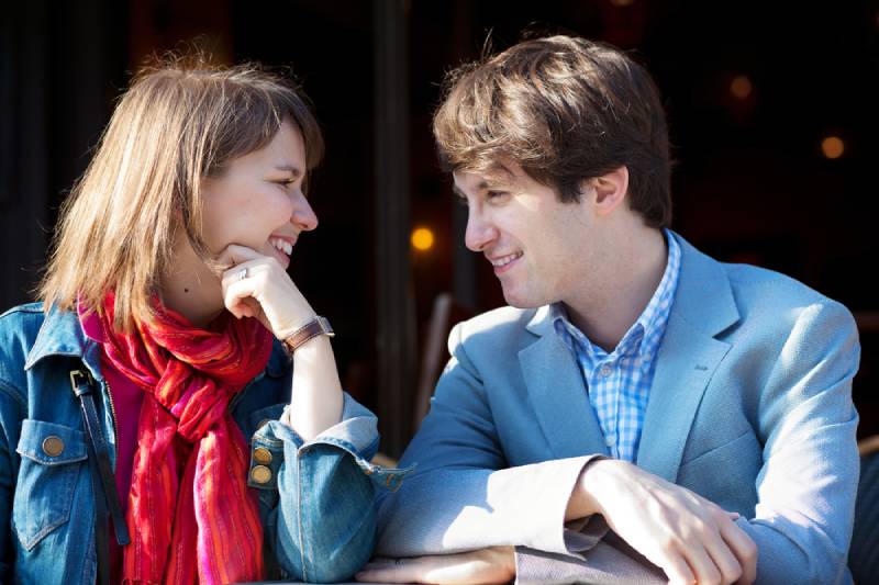 young couple eye contact outside