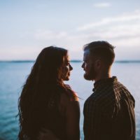 couple in love standing in front of the sea