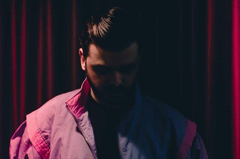 man looking down in the dark