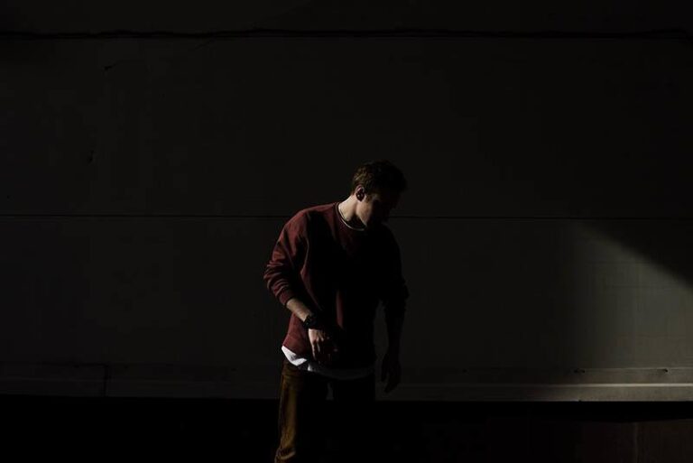man standing in the dark