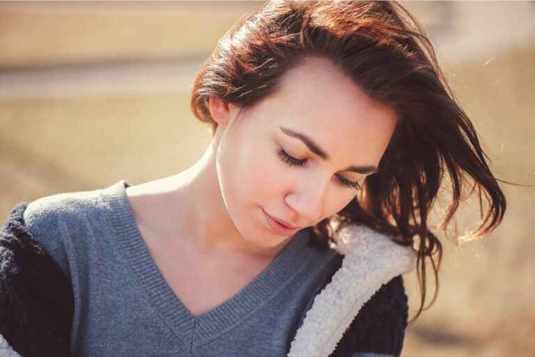 closeup portrait of young thoughtful woman.