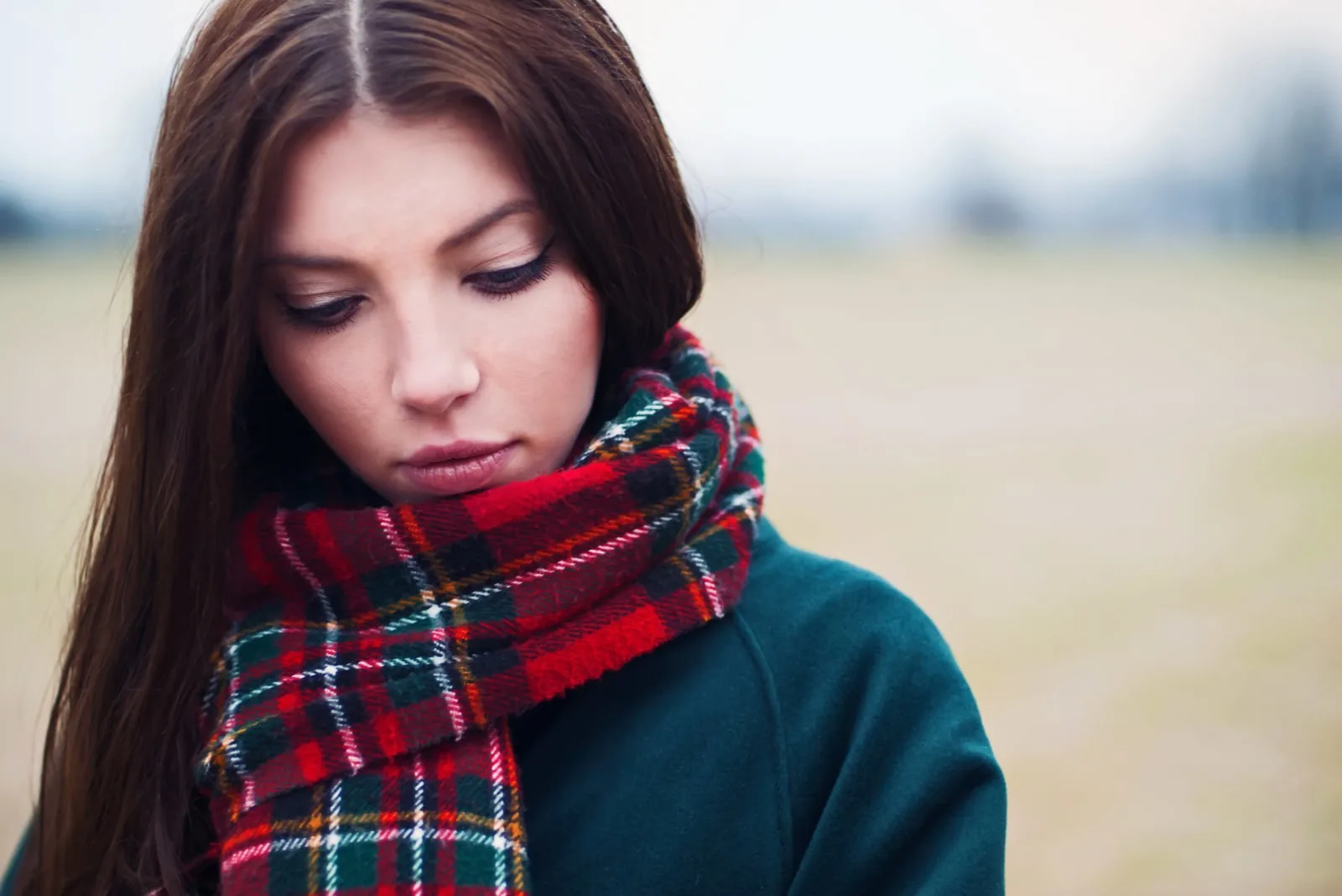 beautiful girl in the park so sad