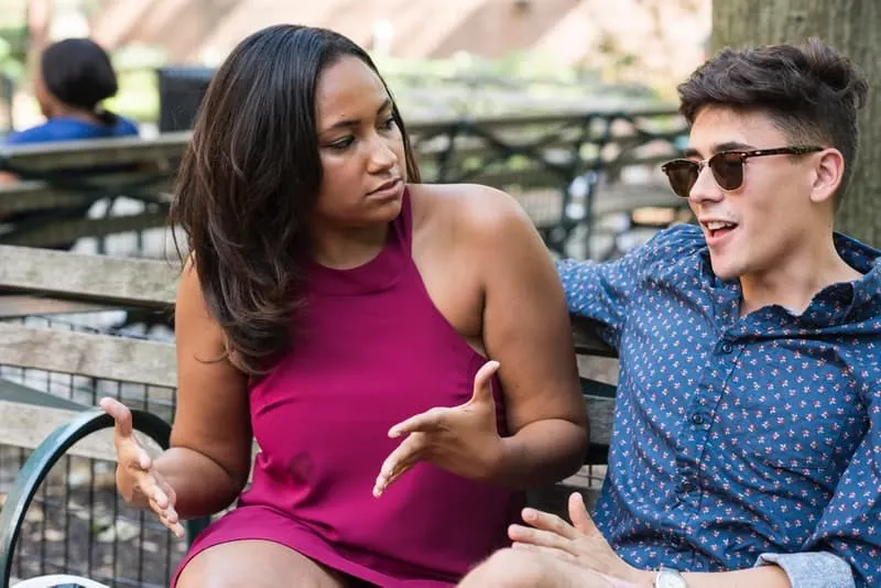 man embarrassing her girlfriend in public
