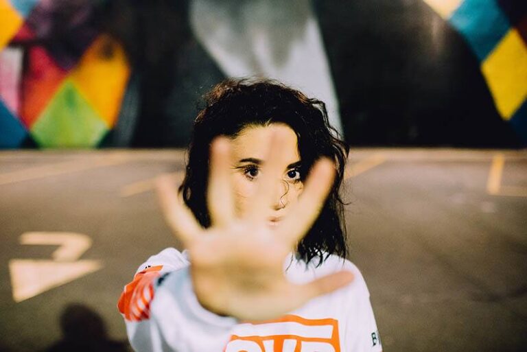 woman raising open hand