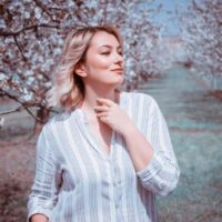 woman surrounded by trees at daytime