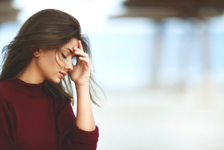 a woman with a downcast look