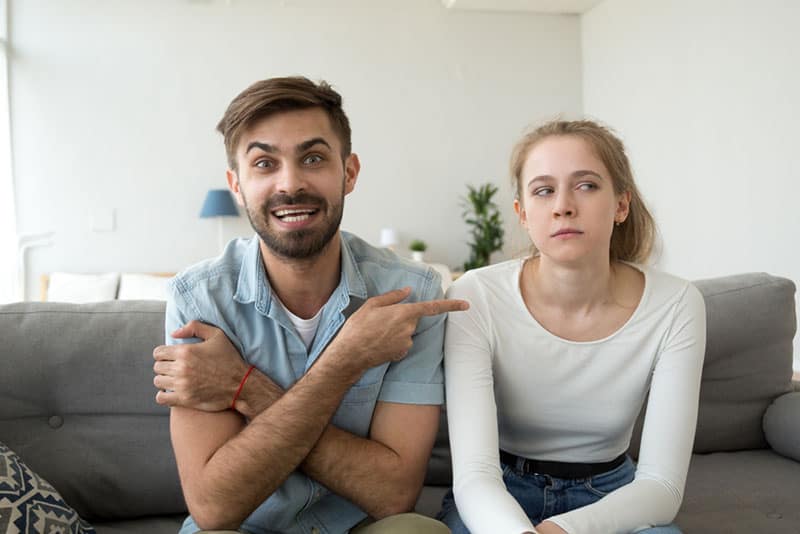 man making fun of woman