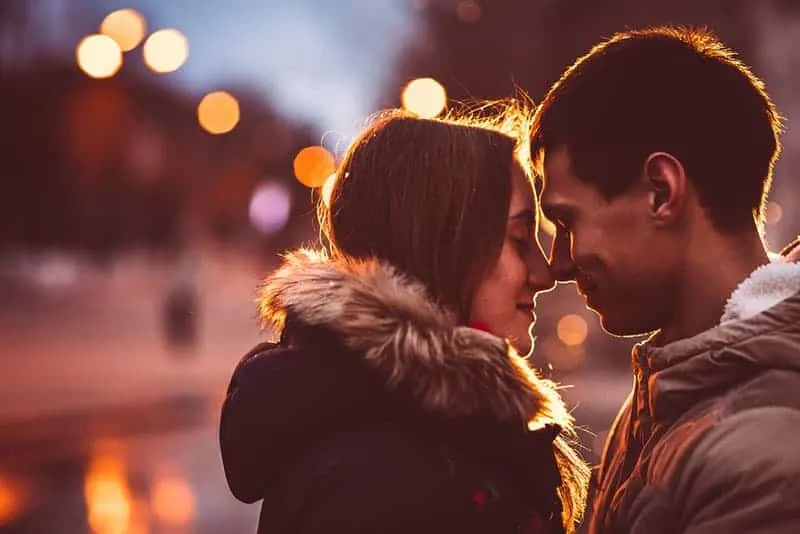 romantic couple kissing outdoors