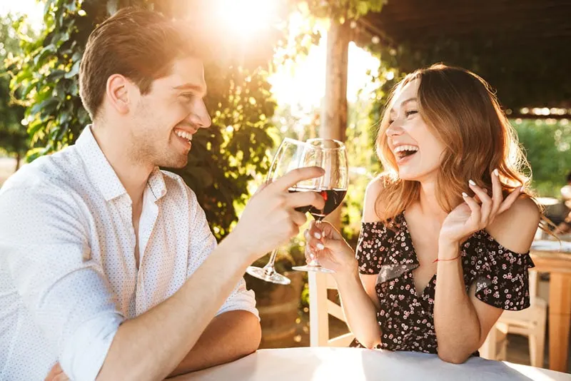 smiling couple drinking wine 