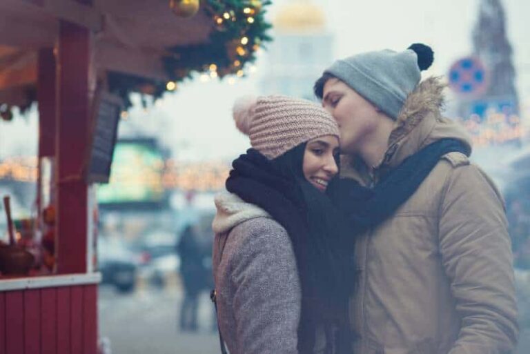 Lovely young couple on Christmas market