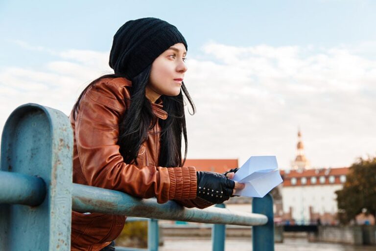 sad woman holding a letter