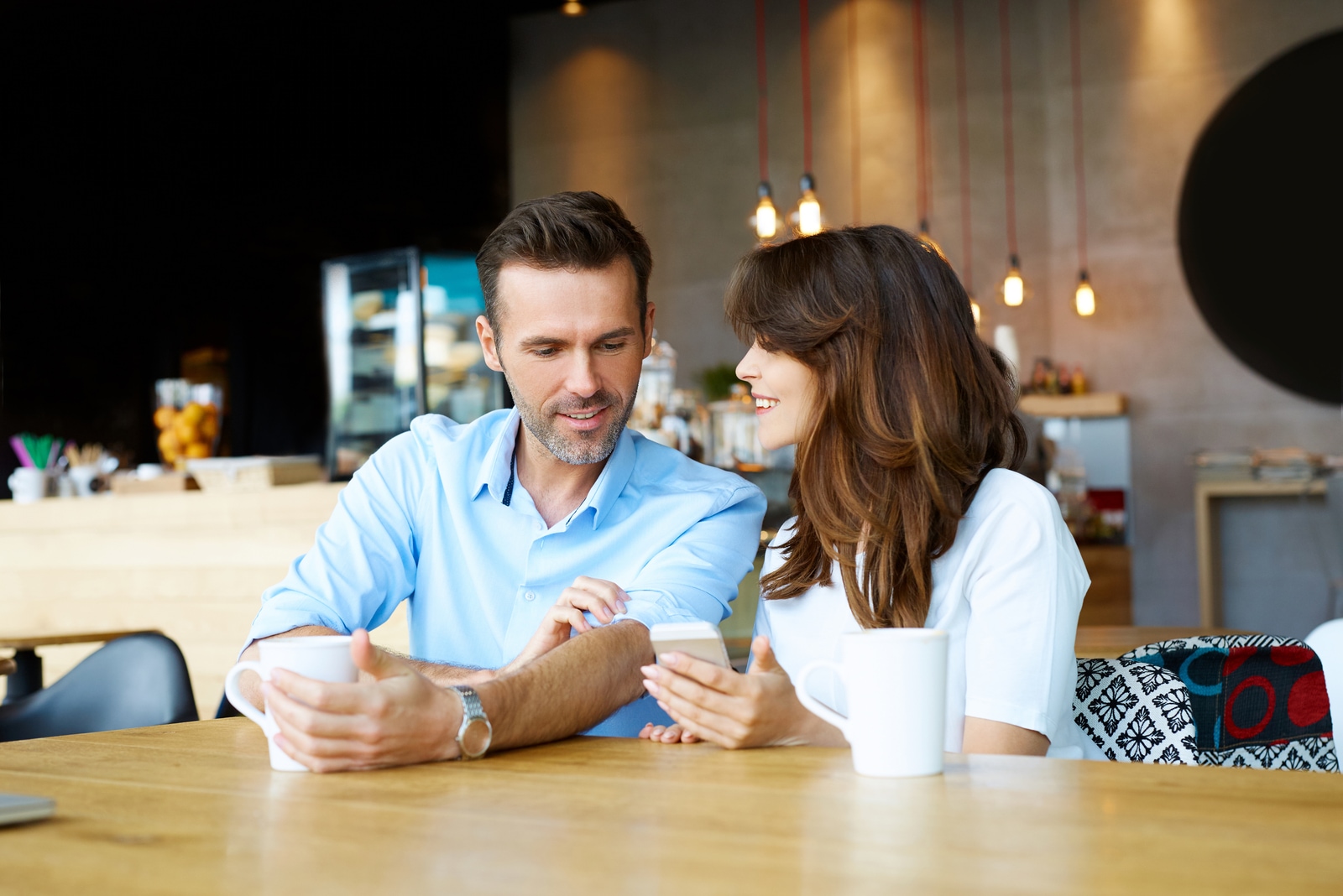 Couple at coffee shop spending time together