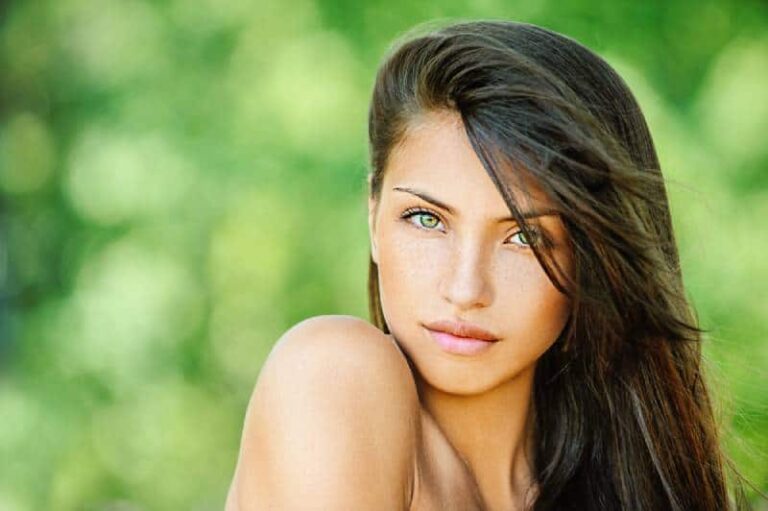 portrait of young beautiful woman with green eyes