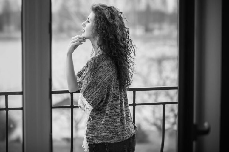 an imaginary woman standing on the balcony
