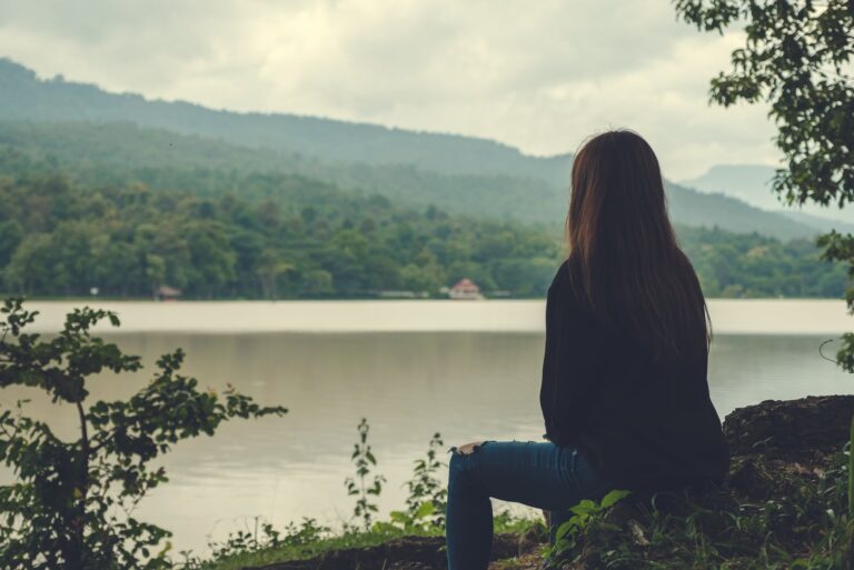lonely woman sitting in nature