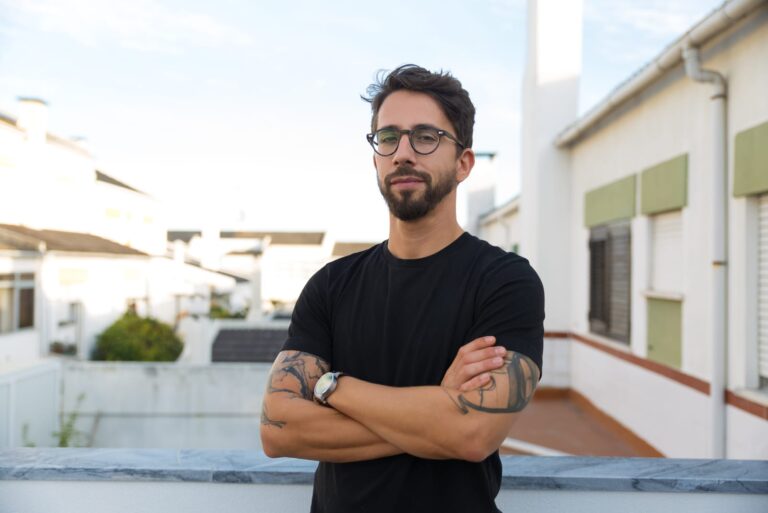 man with glasses wearing black t shirt