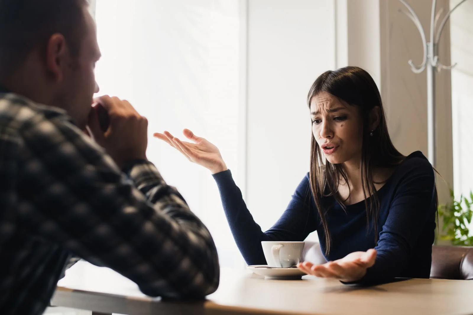 a man and a woman quarrel while talking