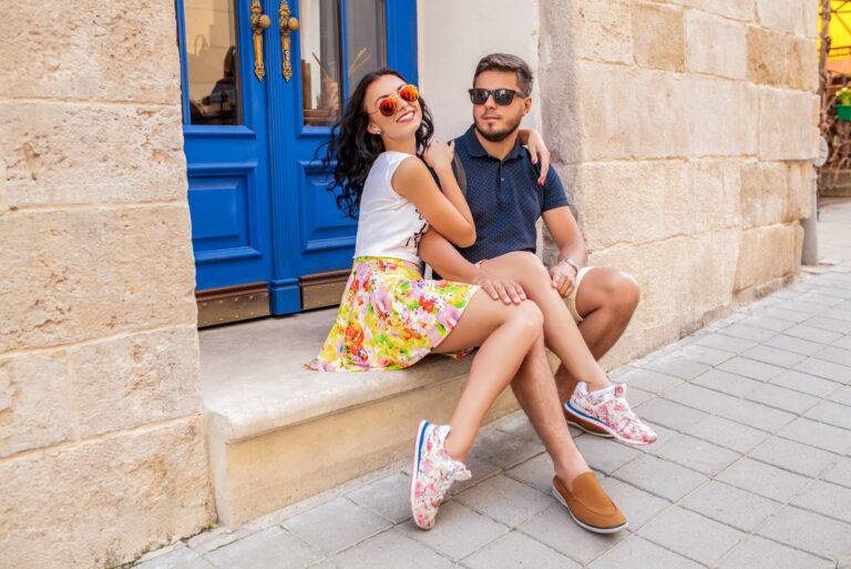a man and a woman are sitting on the stairs