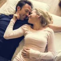 lovely couple lying on bed