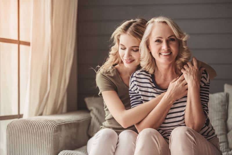 Daughter hugs mother gratefully for having her