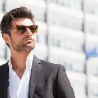 man in suit wearing sunglasses outside