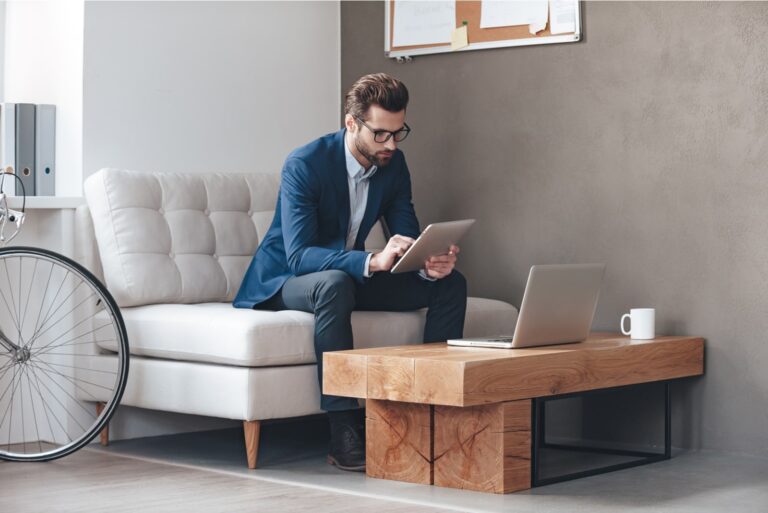 a man sitting with a phone in his hand