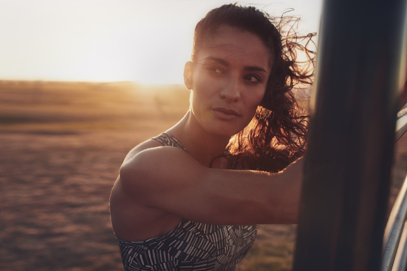 a portrait of a determined woman at sunset