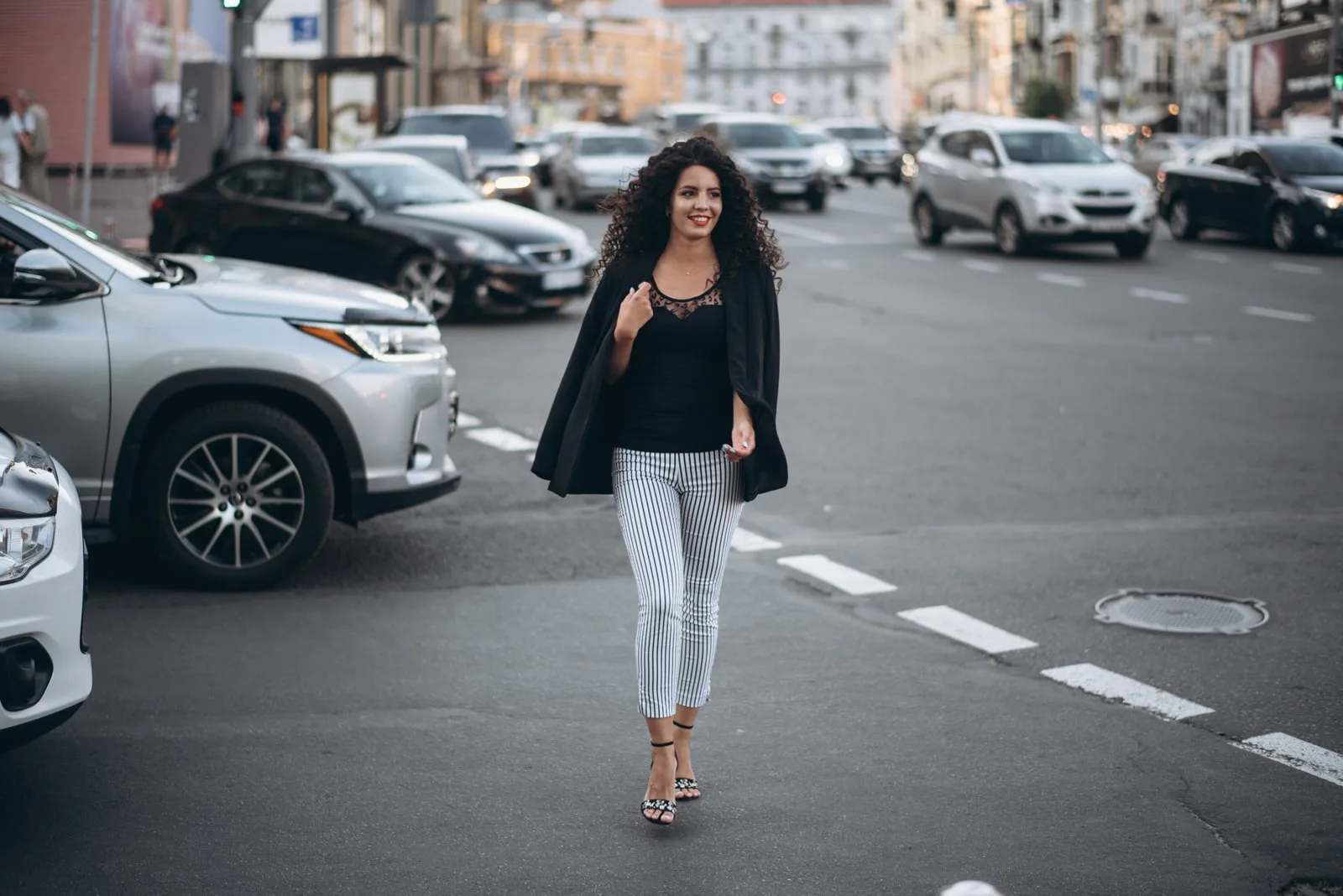 a woman walks down the street