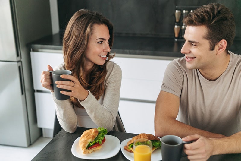 happy couple having breakfast