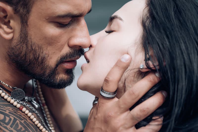 man kissing woman passionately