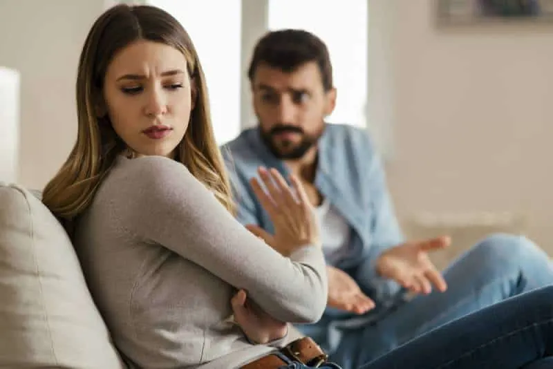 worried girl refuse to talk with her boyfriend at home