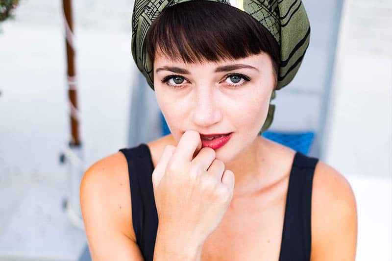 young woman with green eyes looking at camera