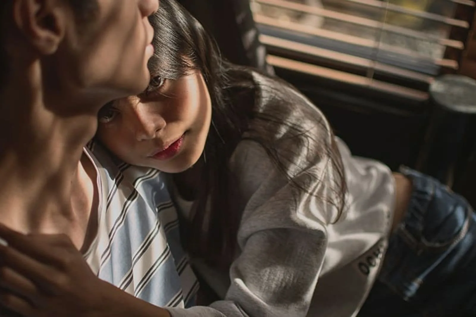 a woman in the arms of a man